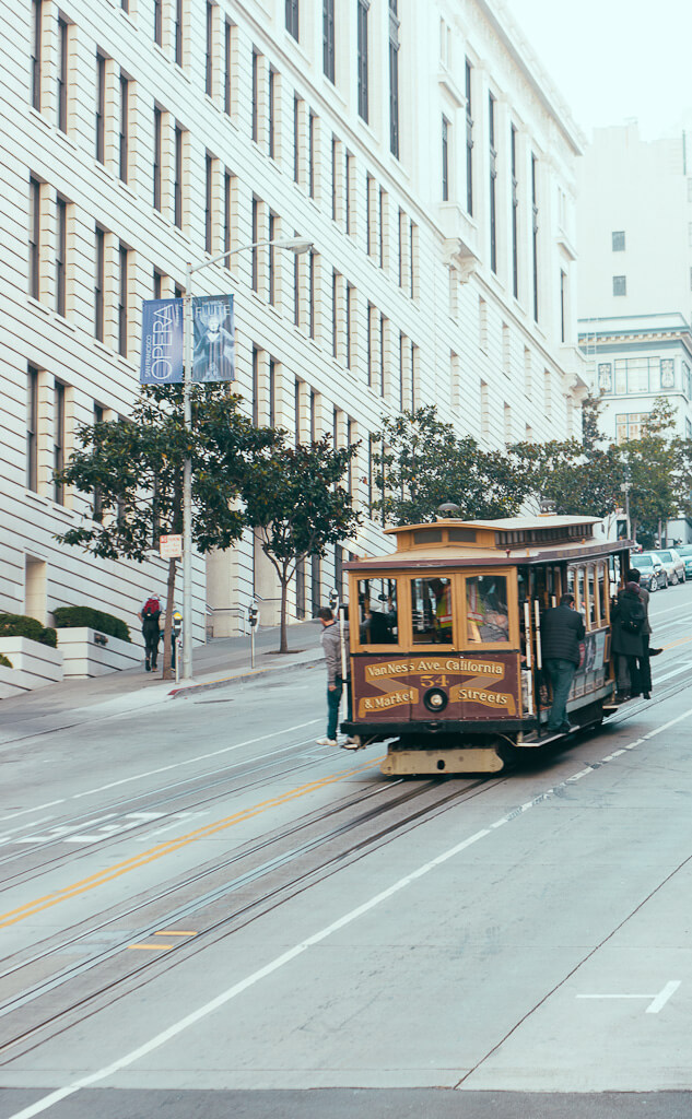 riding the cable car in San Francisco is a great date idea and romantic thing to do